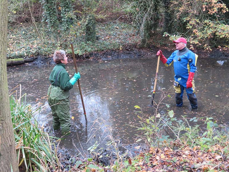 Dave and Clare working in the pond